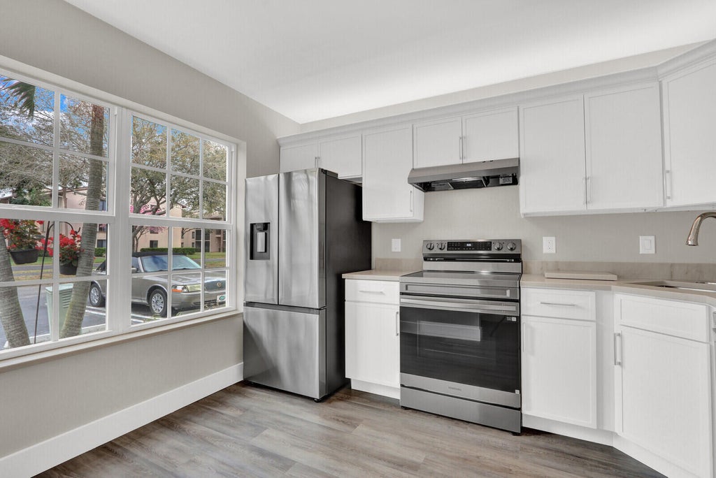 Photo of 234 FOXTAIL Drive #E, Greenacres, FL 33415 (MLS # B26074393)