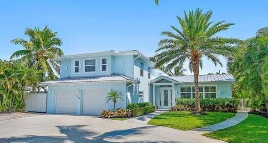 BRING YOUR BOATS!! STUNNING WATERFRONT HOME - COMPLETELY REMODELED!! LOCATED IN THE HIGHLY SOUGHT AFTER NORTH PALM BEACH VILLAGE! This gorgeous 4 bedroom, 4.5 bath home will not disappoint! Two beautiful master bedrooms (one main level) Awesome kitchen, amazing master bedroom suite on the first floor with enormous closet. Large sundeck/balcony off the upstairs master bedroom and great living space throughout the home. Separate entertainment loft upstairs. Beautiful backyard with pool and hot tub. Covered lanai includes a great bar and seating area - fantastic outdoor space to enjoy the Florida lifestyle! Property has 80 feet of water frontage. Includes TWO boat lifts, AND space on the dock for an additional 40 ft boat. Beautiful backyard with exquisite landscaping and lightin