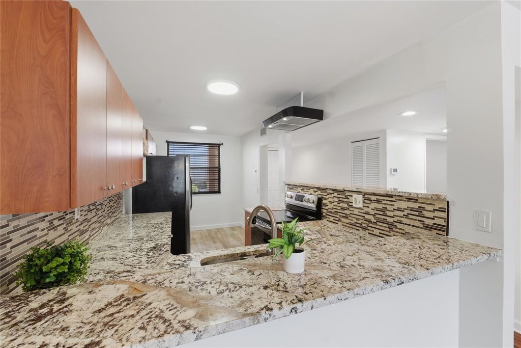 Photo of 9549 W McNab Road #103, Tamarac, FL 33321 (MLS # F10550662)