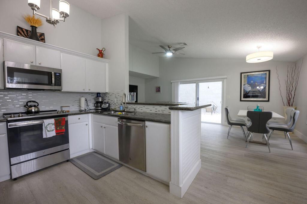 Photo of 22829 N Sandalfoot Boulevard, Boca Raton, FL 33428 (MLS # R11051658)
