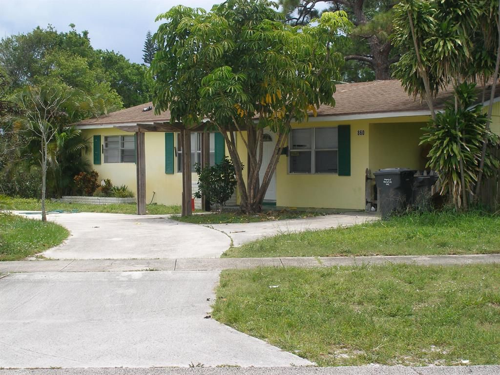 Photo of 860 Magnolia Drive, Lake Park, FL 33403 (MLS # R10670263)