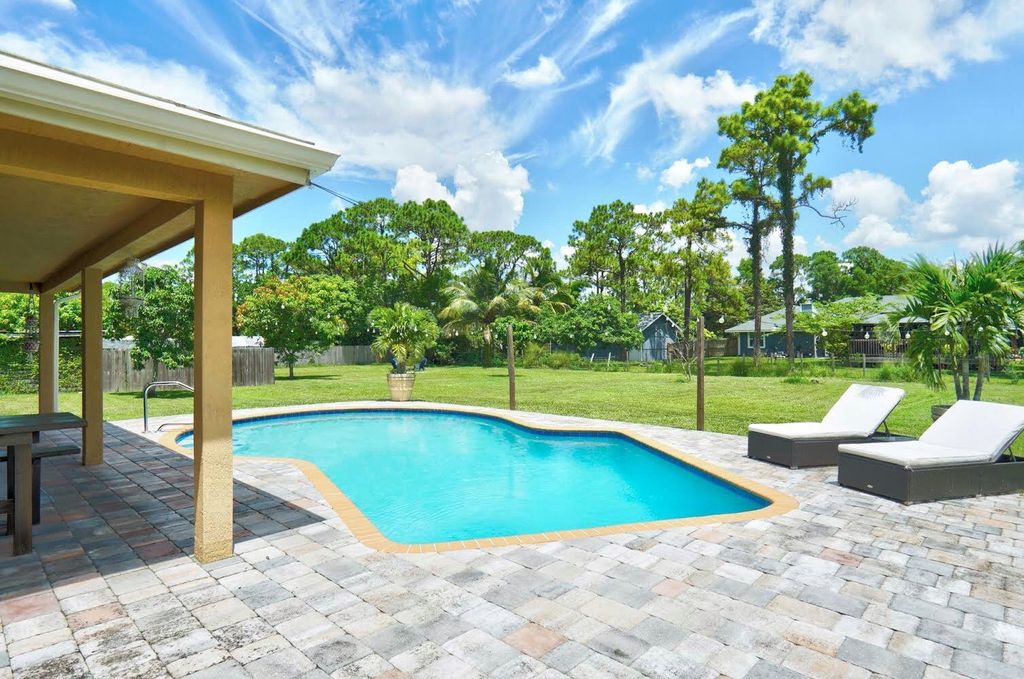 Photo of 16113 E Cheltenham Drive, Loxahatchee, FL 33470 (MLS # R11008438)