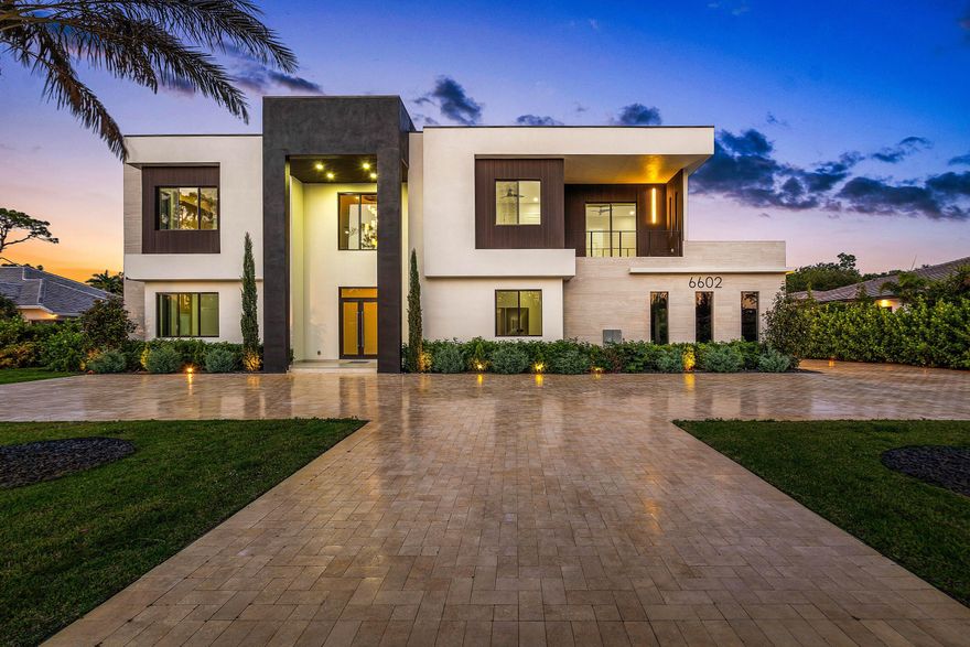Brand-new luxury estate on over half an acre in Parkland with no HOA! Featuring 7 ensuite bedrooms and 8.5 bathrooms, this residence delivers exceptional scale, privacy, flexibility and luxury. A dramatic open-concept layout is anchored by a chef's kitchen with four ovens and premium finishes, designed to handle everything from daily living to large-scale entertaining. The floor plan is built for versatility, offering multiple primary suites (including one on the main level), two laundry rooms, a mudroom, & extensive storage. Upstairs, a dedicated entertainment lounge with a full bar creates a true second living space. The outdoor setting is spectacular—resort-style pool and spa, summer kitchen, cabana bath, covered dining, expansive patio, & large upper balcony. Three car garage.... Three-car garage. No HOA. New construction on usable land in one of Parkland's most desirable areas. Add a guest house or tennis court! Zoned for top-rated schools and minutes from golf, parks, dining, shopping, and South Florida beaches. Properties offering this combination of size, condition, and freedom are limited—schedule your private showing today.