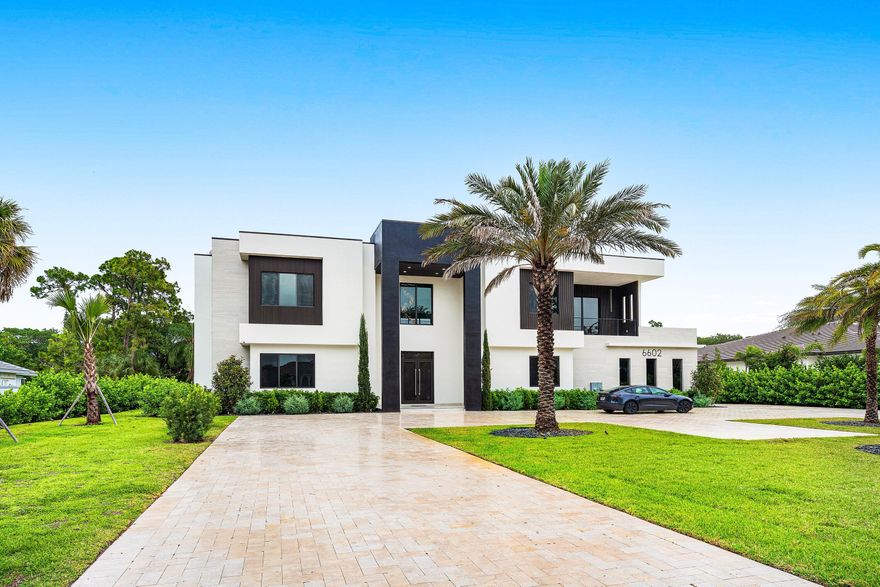 Brand-new luxury estate on over half an acre in Parkland with no HOA! Featuring 7 ensuite bedrooms and 8.5 bathrooms, this residence delivers exceptional scale, privacy, flexibility and luxury. A dramatic open-concept layout is anchored by a chef's kitchen with four ovens and premium finishes, designed to handle everything from daily living to large-scale entertaining. The floor plan is built for versatility, offering multiple primary suites (including one on the main level), two laundry rooms, a mudroom, & extensive storage. Upstairs, a dedicated entertainment lounge with a full bar creates a true second living space. The outdoor setting is spectacular—resort-style pool and spa, summer kitchen, cabana bath, covered dining, expansive patio, & large upper balcony. Three car garage.... Three-car garage. No HOA. New construction on usable land in one of Parkland's most desirable areas. Add a guest house or tennis court! Zoned for top-rated schools and minutes from golf, parks, dining, shopping, and South Florida beaches. Properties offering this combination of size, condition, and freedom are limited—schedule your private showing today.