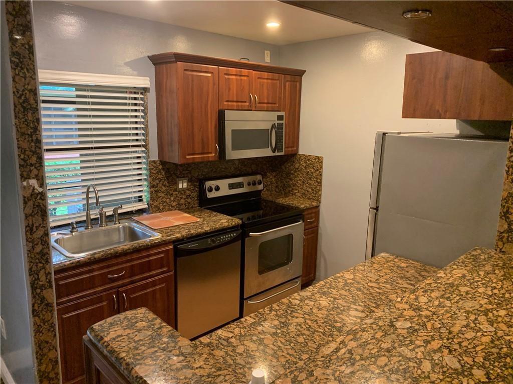 2 master bedroom, 2 full bathrooms with a 1/2 bathroom on the first floor. Washer and Dryer inside the unit, eat in kitchen with stainless steel appliances, laminate wood flooring. Private cover screen porch, community pool, parking right in front of your own door. Located in a quite area in West Plantation, excellent location just west of University Drive, south of Cleary Blvd, easy access to I-595, I-95 and the Sawgrass Expressway. Walking distance to shopping and restaurants. Right near the new Plantation Walk. Only 3 miles from Nova University and other colleges.