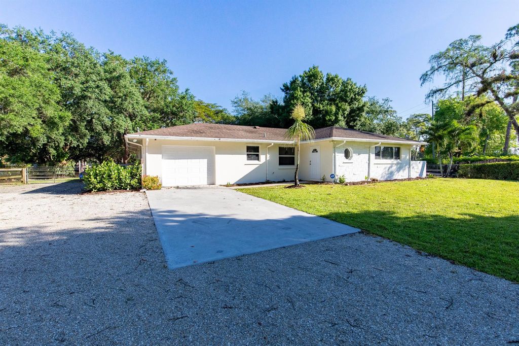 Photo of 13529 E Citrus Drive, Loxahatchee Groves, FL 33470 (MLS # R11138600)