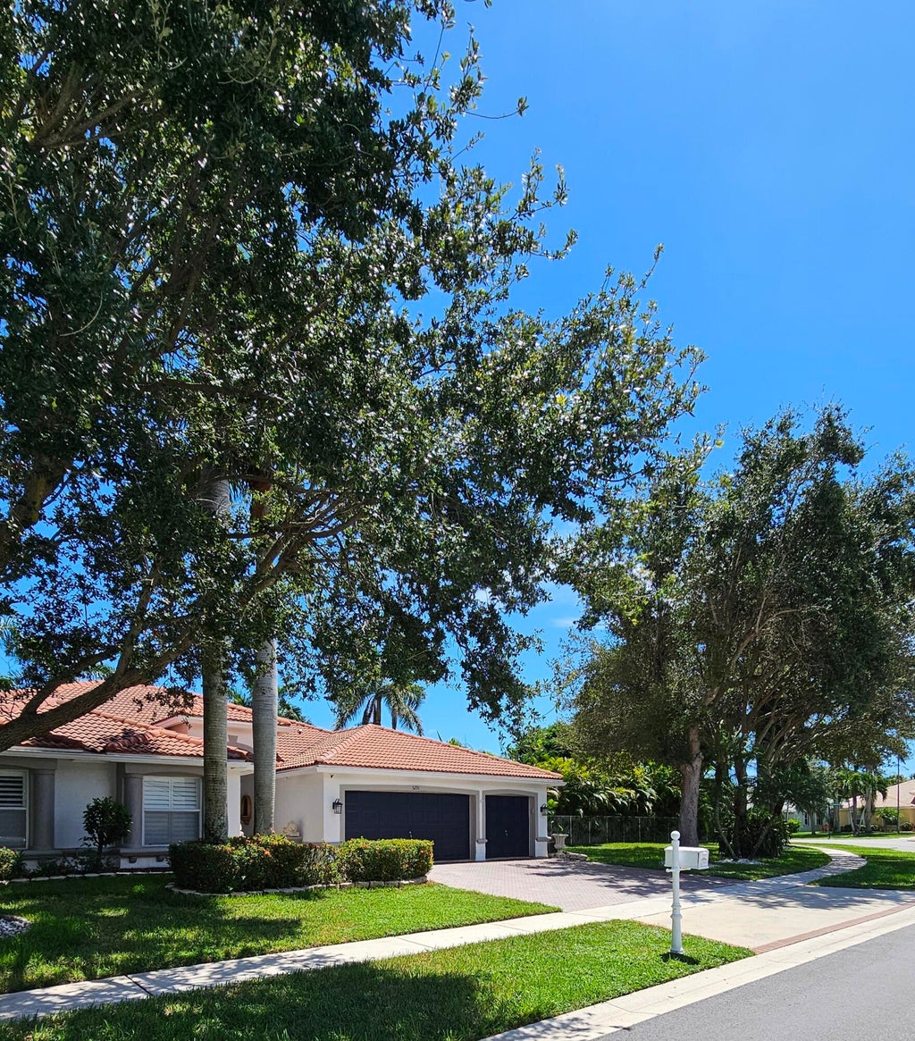 Photo of 5291 Indianwood Village Lane, Lake Worth, FL 33463 (MLS # B26071854)
