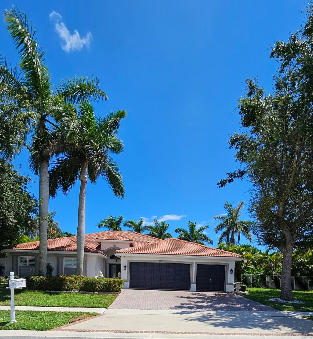 Photo of 5291 Indianwood Village Lane, Lake Worth, FL 33463 (MLS # B26071854)