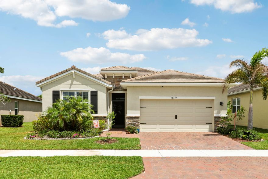 CBS 4/2 bath 2 car garage , 2034 sq ft. living area Includes a brick paver drive & entry, Built in 2020.  23x9 Screened lanai and irrigation and is energy efficient. The Delray model features granite counters in the Kitchen, 36'' upper cabs and Moen sink. 18'' tile throughout and carpet in bedrooms. 9Ft ceilings. Home is energy efficient. Upgrades: Fenced backyard, gutters, Screened Lanai and Front Entryway, Laundry room cabinets, additional ceiling lights in living and master bedroom, storage expansion in master closets , ceiling fans in each room and patio.  Community  pool and security gate. The Tradition area has nice small downtown  feel with different event most weekends, concerts, carnivals, farmers markets in the town square. Lots of family events. Included in HOA   fees: cable TV with Tivo, Internet, land line phone, security system and Landscaping.