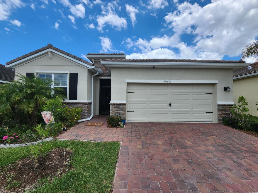 CBS 4/2 bath 2 car garage , 2034 sq ft. living area Includes a brick paver drive & entry, Built in 2020.  23x9 Screened lanai and irrigation and is energy efficient. The Delray model features granite counters in the Kitchen, 36'' upper cabs and Moen sink. 18'' tile throughout and carpet in bedrooms. 9Ft ceilings. Home is energy efficient. Upgrades: Fenced backyard, gutters, Screened Lanai and Front Entryway, Laundry room cabinets, additional ceiling lights in living and master bedroom, storage expansion in master closets , ceiling fans in each room and patio.  Community  pool and security gate. The Tradition area has nice small downtown  feel with different event most weekends, concerts, carnivals, farmers markets in the town square. Lots of family events. Included in HOA   fees: cable TV with Tivo, Internet, land line phone, security system and Landscaping.