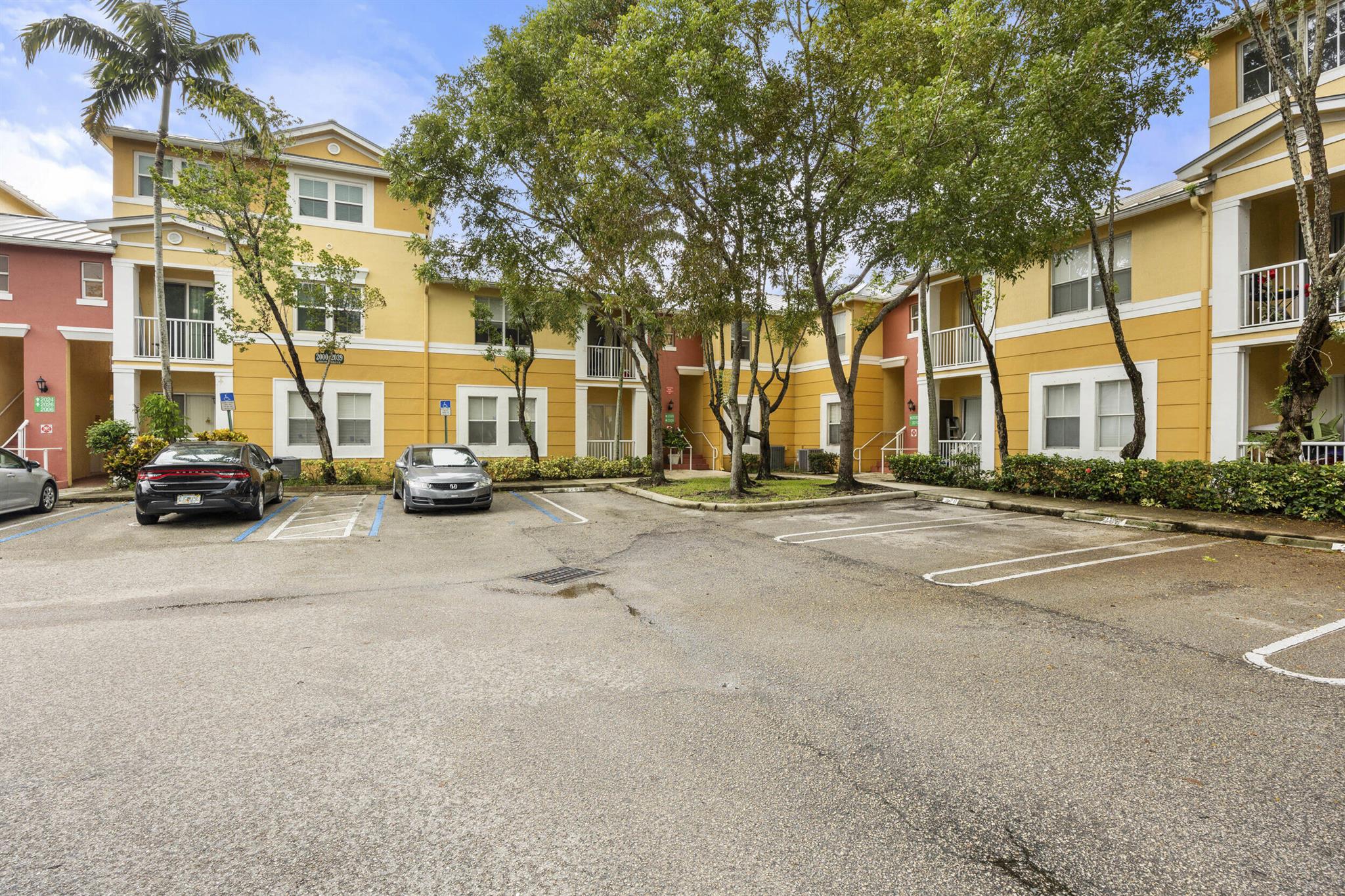 Re-Imagine, prepare to be reinspired, and redefine how condo living can be exemplified as an investors dream or if this is a home purchased for your very first time. Over 1600 sq ft with an atypically light drenched layout offering open conceptualized living distributed as a 3 bedroom and 2 and half bath configuration. Bring your toothbrush, luggage, and furniture to this turnkey, move in ready, fully updated, pridefully owned, and meticulously maintained ground floor abode. Featuring over 40k in recent modifications including custom cherry wood cabinetry, exquisite and immaculate new bathrooms, new tiling laid along the satellite rooms amongst the floor plan, and brand-new metal roofing which is upkept by the association. This abundantly spaced and extremely rare model can be rented