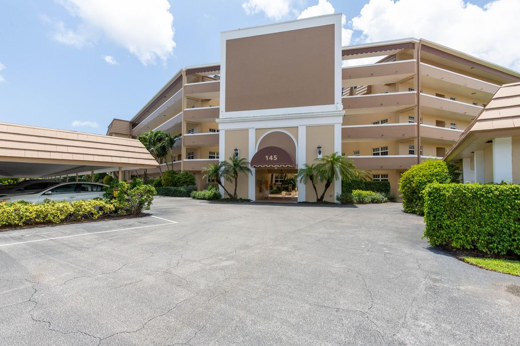 Photo of 145 Atlantis Boulevard #107, Atlantis, FL 33462 (MLS # R10946489)