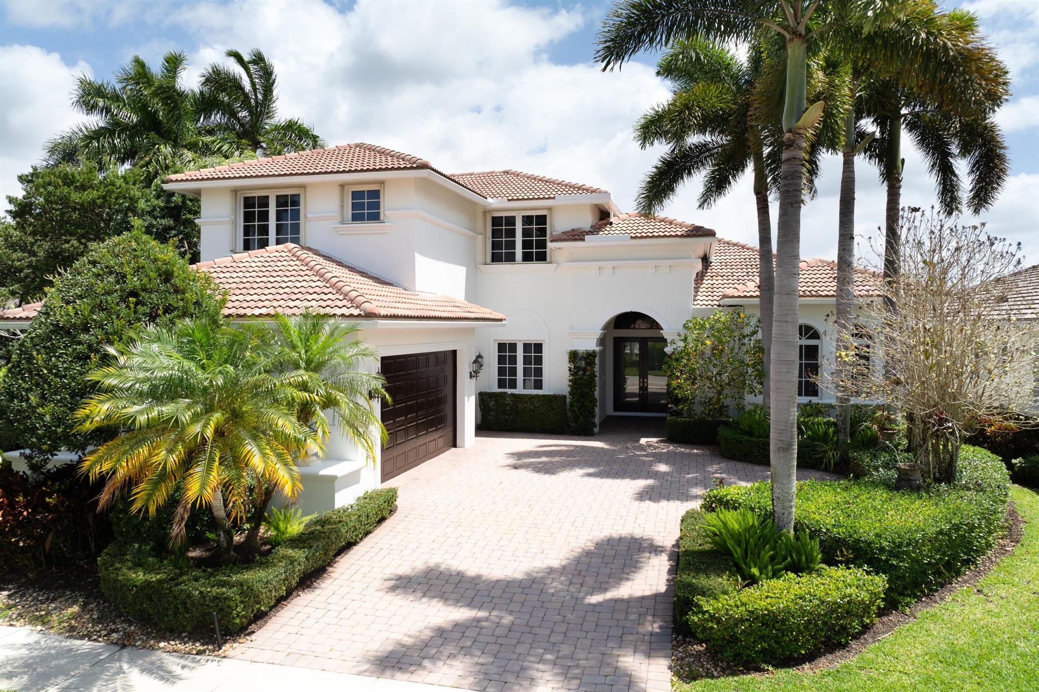 PREMIER GOLF MEMBERSHIP AVAILABLE! Spectacular estate home offering many upgrades with an unbelievably serene long lake view. This home offers 5br plus den and 4.5 baths. Spacious kitchen has been upgraded with ALL NEW S/S appliances (2023) to include range hood and gas stove. Large walk-in pantry with custom shelving. Open dining room with separate butler's pantry for easy prep and additional storage. Expansive living room area greets you upon entering displaying phenomenal water views. Elegant first floor primary bath has been redesigned to include NEW (2023) cabinets and countertops, his/her sinks and closet for extra storage. 2 a/c's 2023, 3rd AC unit 2021. Pool heater and filter 2023. Newly screened lanai . New interior paint (2023) and exterior paint (2025).
