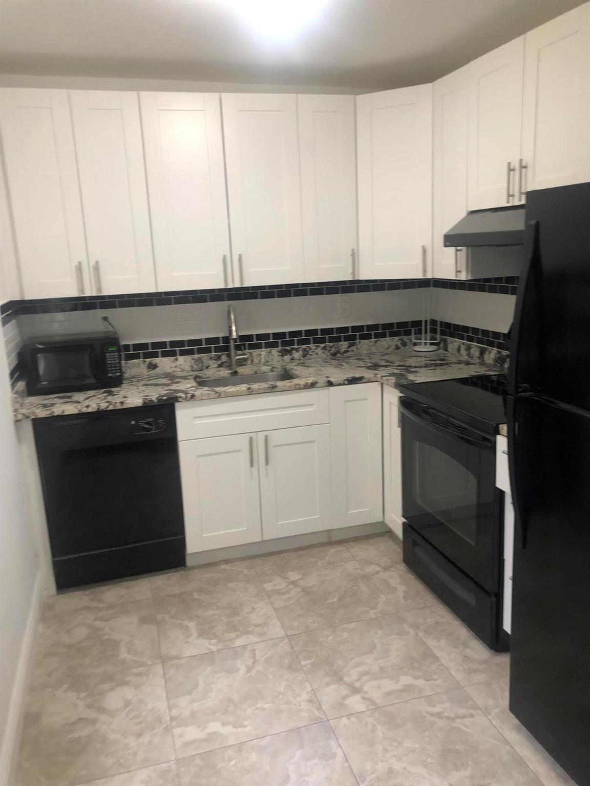 Updated 1st floor 2/2 condo in Gated 55+ Kings Point active community with laminate flooring featuring granite countertop and newly updated bathrooms. Unit also features an enclosed Florida room, in-unit laundry and all the various Kings Point amenities available for your enjoyment. Golf, pools, clubhouse, gym, tennis, shuttle services and more all at your disposal. Unit located in well maintained and one of the newest Kings Point buildings. Gated community with basic cable included.