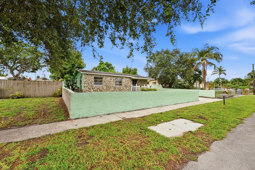 No homeowners association !  A Charming and beautifully maintained 2-bedroom, 1-bath single-family home with a bonus office, situated on an oversized,  fenced lot in a highly desirable location just minutes from the world-famous Hard Rock casino  This quaint, cozy home is move-in-ready and  offers approximately 1,100 square feet of comfortable living space and is perfect for first-time homebuyers, downsizing , or anyone seeking an affordable South Florida lifestyle. Recent updates and renovations provide modern appeal. Enjoy peace of mind with a newer A/C system installed in 2020. The spacious yard offers endless possibilities for entertaining, pets, gardening, expansion, or storing recreational equipment. Conveniently located near major highways, shopping, dining, entertainment