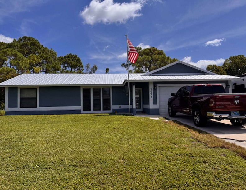 This 3-bedroom, 2-bath offers comfort and convenience in a desirable neighborhood. Featuring a new metal roof, interior laundry room, new stainless steel appliances, 1.5 car garage for extra storage, covered patio overlooking a large backyard, this home is thoughtfully designed for everyday living. Its ideal location provides easy access to shopping, restaurants and I-95 & the turnpike making commuting a breeze while still enjoying the peace of this well-established community.