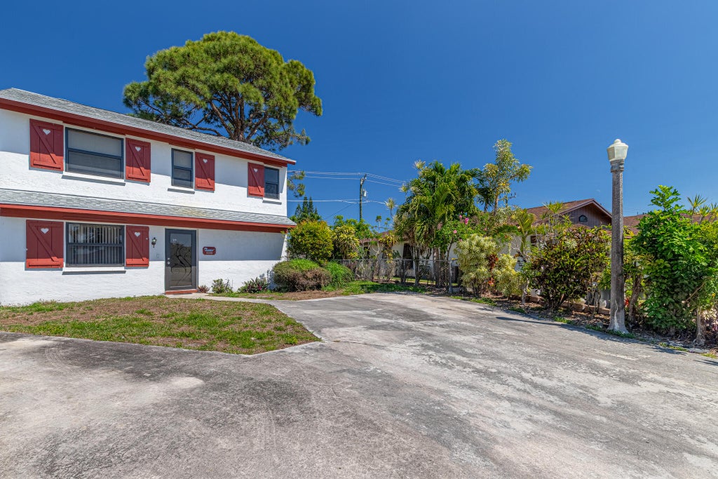 Photo of 2895 Via Del Lago, Lake Worth, FL 33461 (MLS # B26008131)