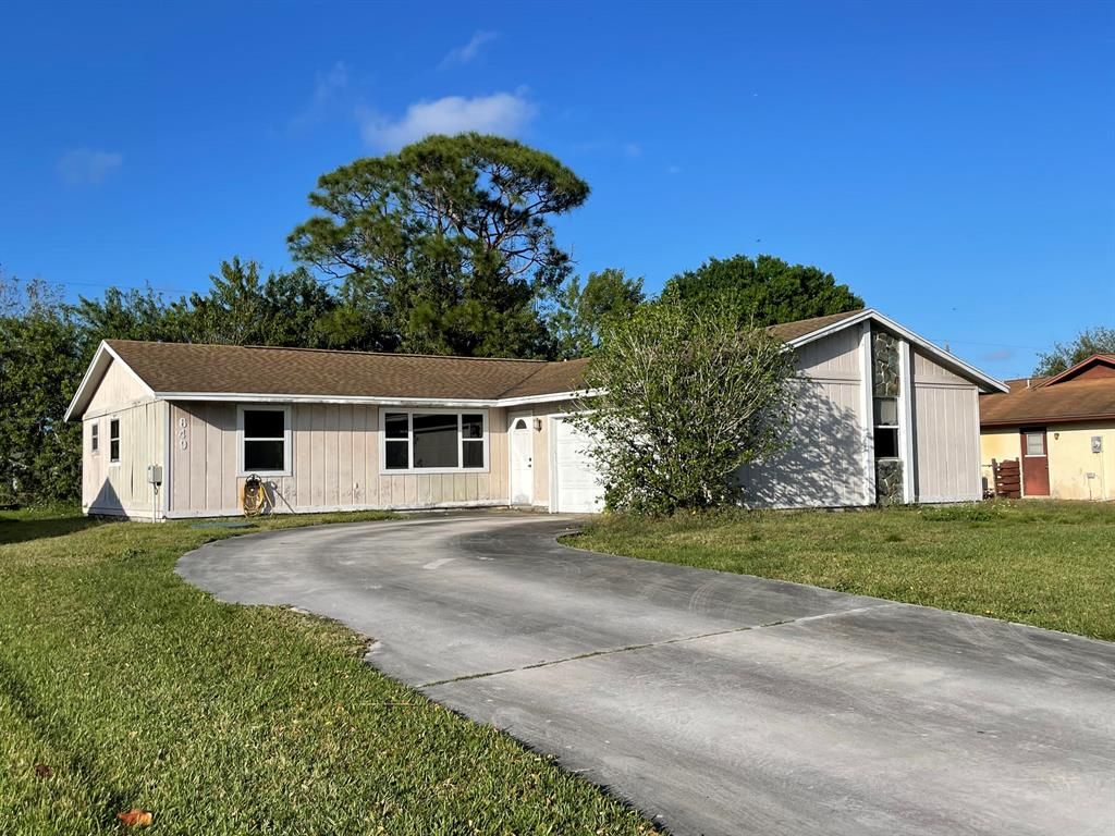 Photo of 649 SE Streamlet Avenue, Port Saint Lucie, FL 34983 (MLS # R10779418)