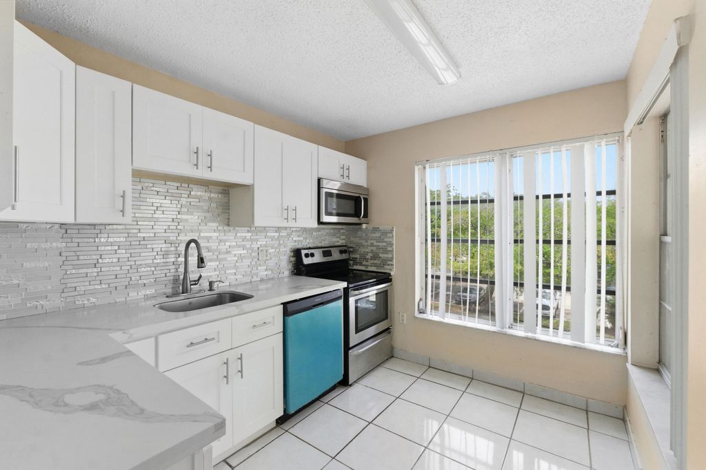 Photo of 4152 Inverrary Drive #311, Lauderhill, FL 33319 (MLS # B26027521)