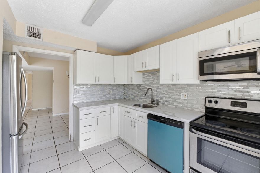 Enjoy a bright, spacious top floor 2 bedroom, 2 bath condo. Featuring updates, the convenience of a washer & dryer inside the unit. Centrally located near shopping, dining, and major highway.