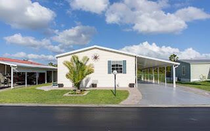 SEMINOLE COVE 3/2 Completely remodeled.  All appliances are 3 yrs old, new flooring and paint throughout.  Hot water heater is 2 yrs old. Plenty of storage with remodeled storage area. This mobile home sits on a CONCRETE PAD.  New countertops in large kitchen.  Laundry is inside with new washer & dryer.  Sprinkler system has its own well.  New finish on carport   Storm coverings for the windows.   AC is 6 years old. Partially furnished and tastefully decorated.  MOVE IN READY  Seminole Cove is an active 55+ community with a heated pool, fish cleaning house, large clubhouse, shuffleboard court and separate space for campers, trailers, etc.  Perfect for year round or a winter retreat.  Please measure rooms for accuracy
