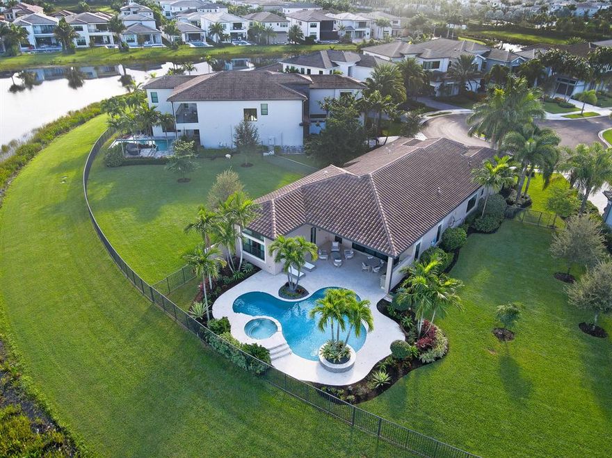 Beautiful wide water views from your resort style pool strategically located at the end of the cul-de-sac. Built 2019 on an oversized premium lot with long lake views & enough room for 2,000 sq ft addition. Enjoy the gourmet kitchen, open floor plan, en-suite bedrooms,15 foot ceilings that lead to your outdoor space made for entertaining. Summer kitchen, heated salt/chlorinated private pool/spa, extended patio & expansive water views. The gated community of Boca Bridges has a 27,000 sq ft clubhouse that includes a sit down restaurant with bar, full-service resort style pool, kids splash park, game room, yoga room, fitness center, indoor basketball, tennis courts & pickleball. Located minutes from the blue water beaches of downtown Delray, fine dining, world class golf, & high end shopping.