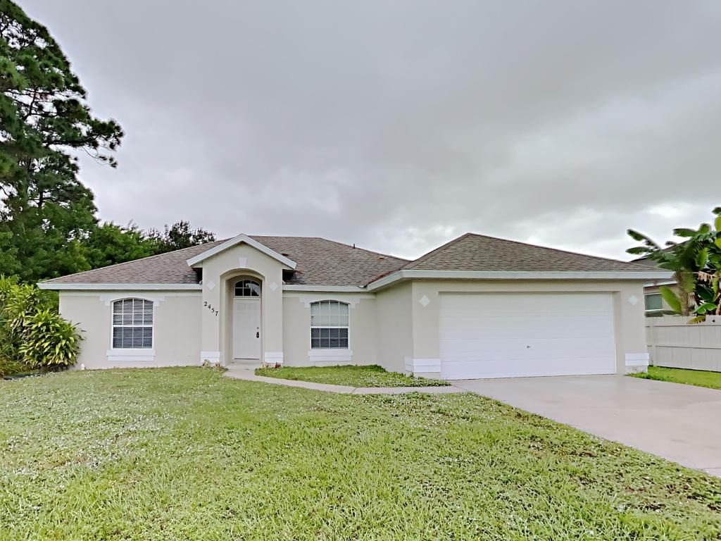 Photo of 2457 SE Betty Road, Port Saint Lucie, FL 34952 (MLS # R10936763)