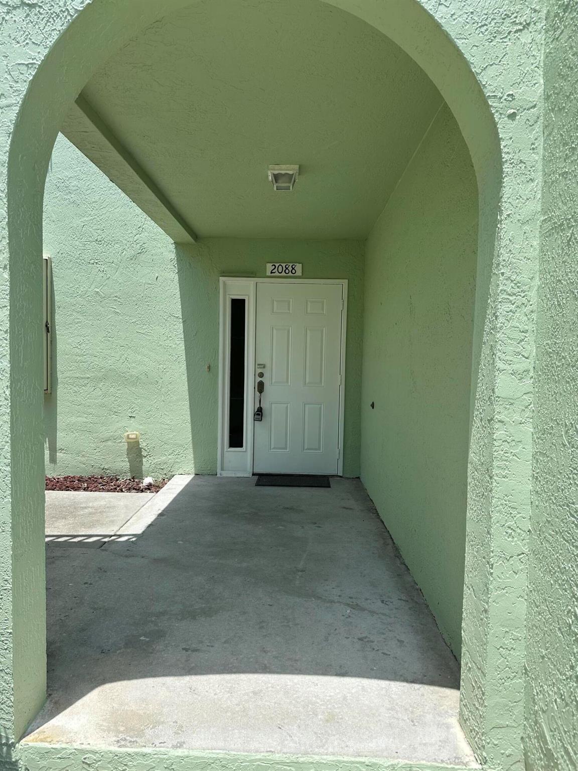 Welcome to this charming 2/2 home with over 1700 sq ft, Unit has all tile floor, a large kitchen with lots of cabinets, open floor plan and bright light. A large covered screen patio with spacious separate laundry room with washer and dryer, accordion shutter all located in this desirable Wild Meadows Community in Port Saint Lucie, FL. This spacious property boasts ample parking and grants you access to a refreshing pool. Situated just 6 minutes away from the picturesque Jensen Beach Park, it offers the perfect blend of relaxation and outdoor activities. Additionally, you'll find yourself conveniently close to shopping destinations, ensuring that all your retail needs are easily met. Come and experience the ultimate Florida lifestyle in this delightful property. HOA approval required