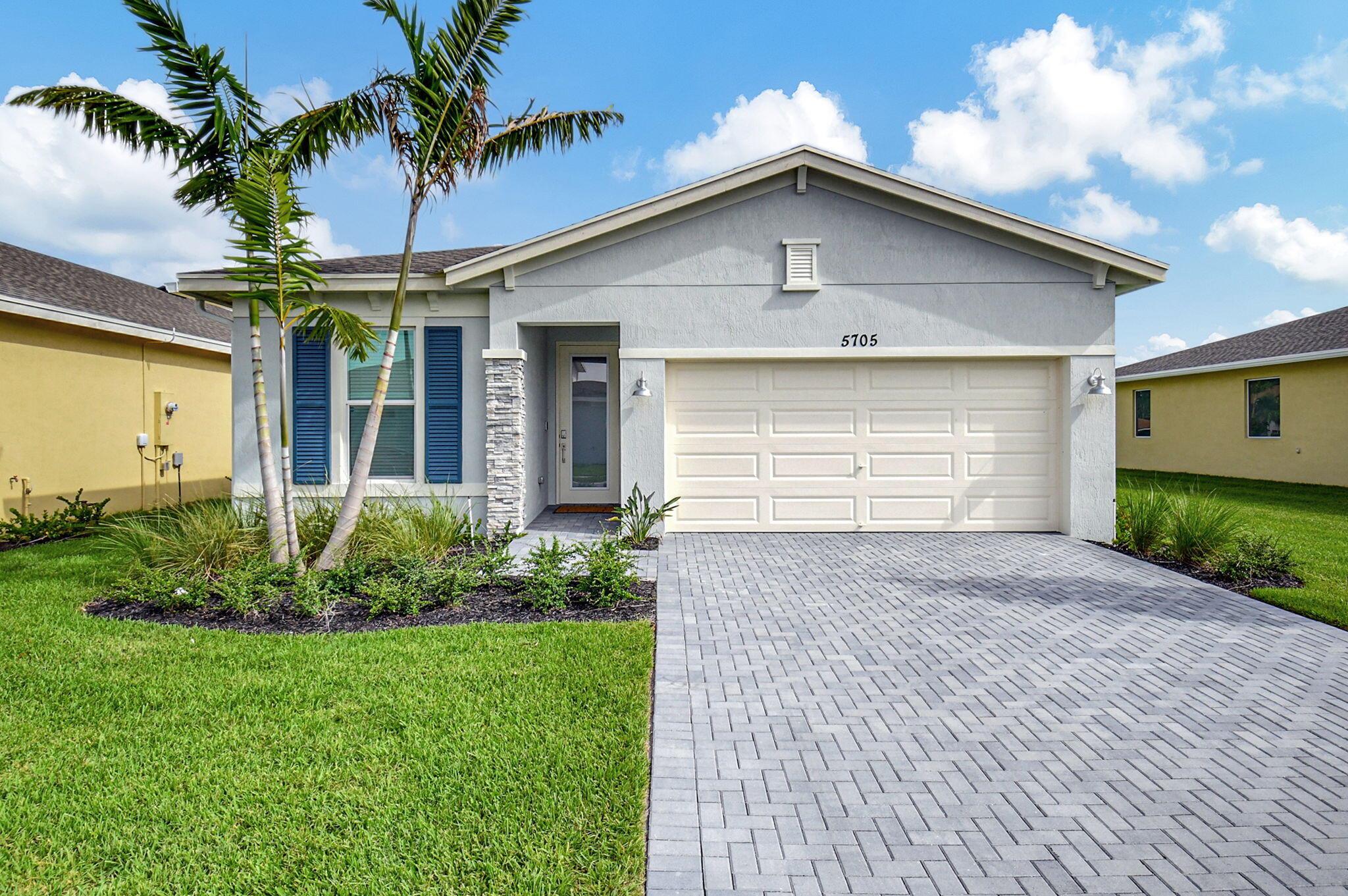 Fantastic opportunity to own this elegant home with a lakefront view in active 55+ community with luxury amenities, just minutes to the beach, boutiques, and dining on the Ave, or charming Pineapple Grove. Lightly lived in seasonal home impeccably cared for is beautifully appointed with designer upgrades including porcelain tile, custom mirror backsplash, glass entry, a current palate; and practical ones like full impact windows that fill the home with light without excess solar gain. Enjoy the best of Florida living with 3 resort style pools, clubhouse, fitness facility, restaurant, tennis, and pickleball. Sidewalks and street lights offer a walkable community and this home's ideal location places you a short stroll to the amenities. See docs for more upgrades and features.