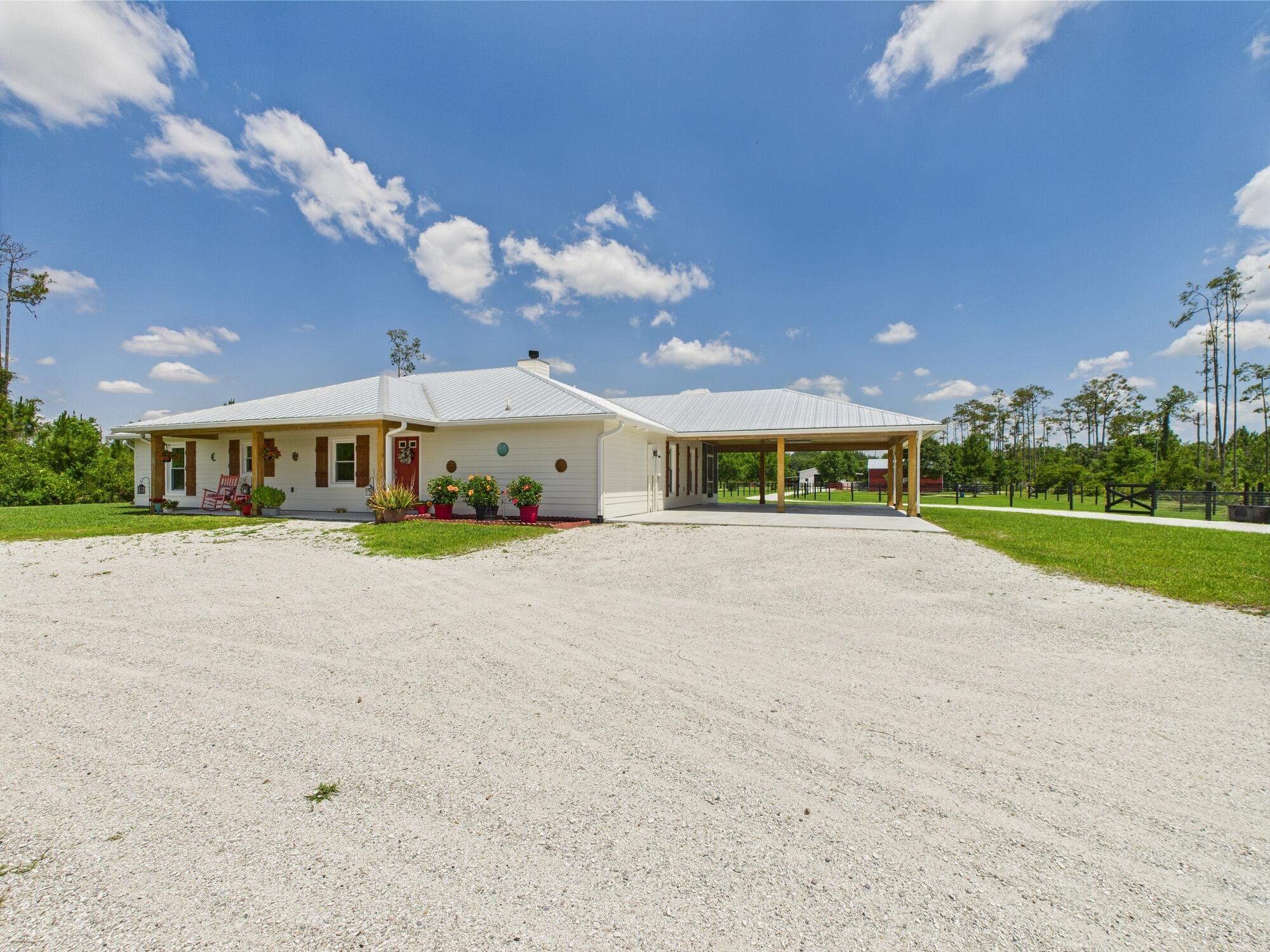 Horse Enthusiasts Dream! Custom Home on 5+ acres in a gated community that is truly a Hidden Gem. This 3/3 is perfectly laid out with Modern Design and Rustic Charm. Enjoy the peaceful view on the screened in porch with tongue and groove ceilings. The Serenity offered on this 5.16 acre property will make you want to stay. This Pristine property has large 6 stall horse barn, tack room, 2 wash/grooming stations, 4 engineered paddocks and arena, and access to hundreds of miles of riding trails with the push of the button. Indian Hammock has over 3,000 acres of land with a private landing strip/hangar, lodge w restaurant and pool, hunting, skeet shooting, rifle range, tennis/pickleball courts, over 100 miles of trails, and so much more!