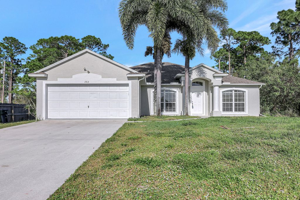 Photo of 1913 SW Mackenzie Street, Port Saint Lucie, FL 34953 (MLS # R10940712)