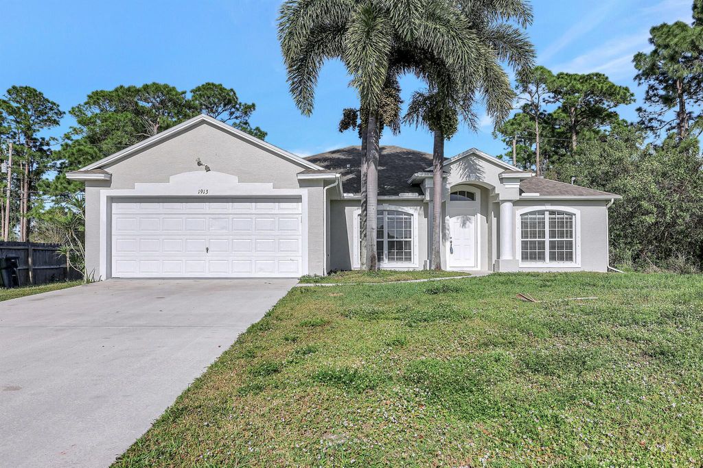 Photo of 1913 SW Mackenzie Street, Port Saint Lucie, FL 34953 (MLS # R10940712)