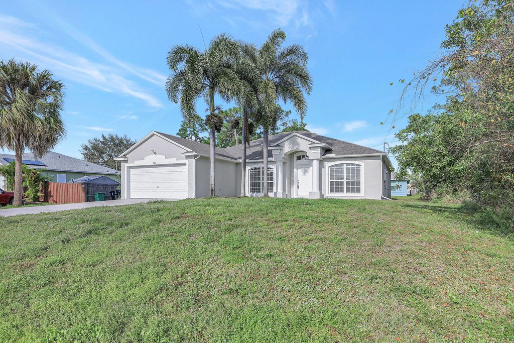 Photo of 1913 SW Mackenzie Street, Port Saint Lucie, FL 34953 (MLS # R10940712)
