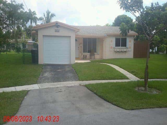 Photo of 3801 NW 36th Street, Lauderdale Lakes, FL 33309 (MLS # B26036465)