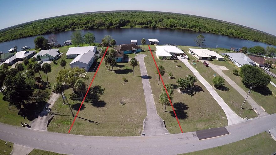 River Oaks! On the wide Kissimmee River. 2 bed 2 bath CBS home with detached garage. 1,620 sq ft under air 2,564 living area. Boat house w/electric & water, 24 x 30 detached garage, Florida room, Island kitchen & 24KW whole house generator (2024) w 500 gal buried propane tank. New a/c (2024) This unique community offers a well maintained, 4,700' lighted, turf airstrip. HOA $125.00 yr.