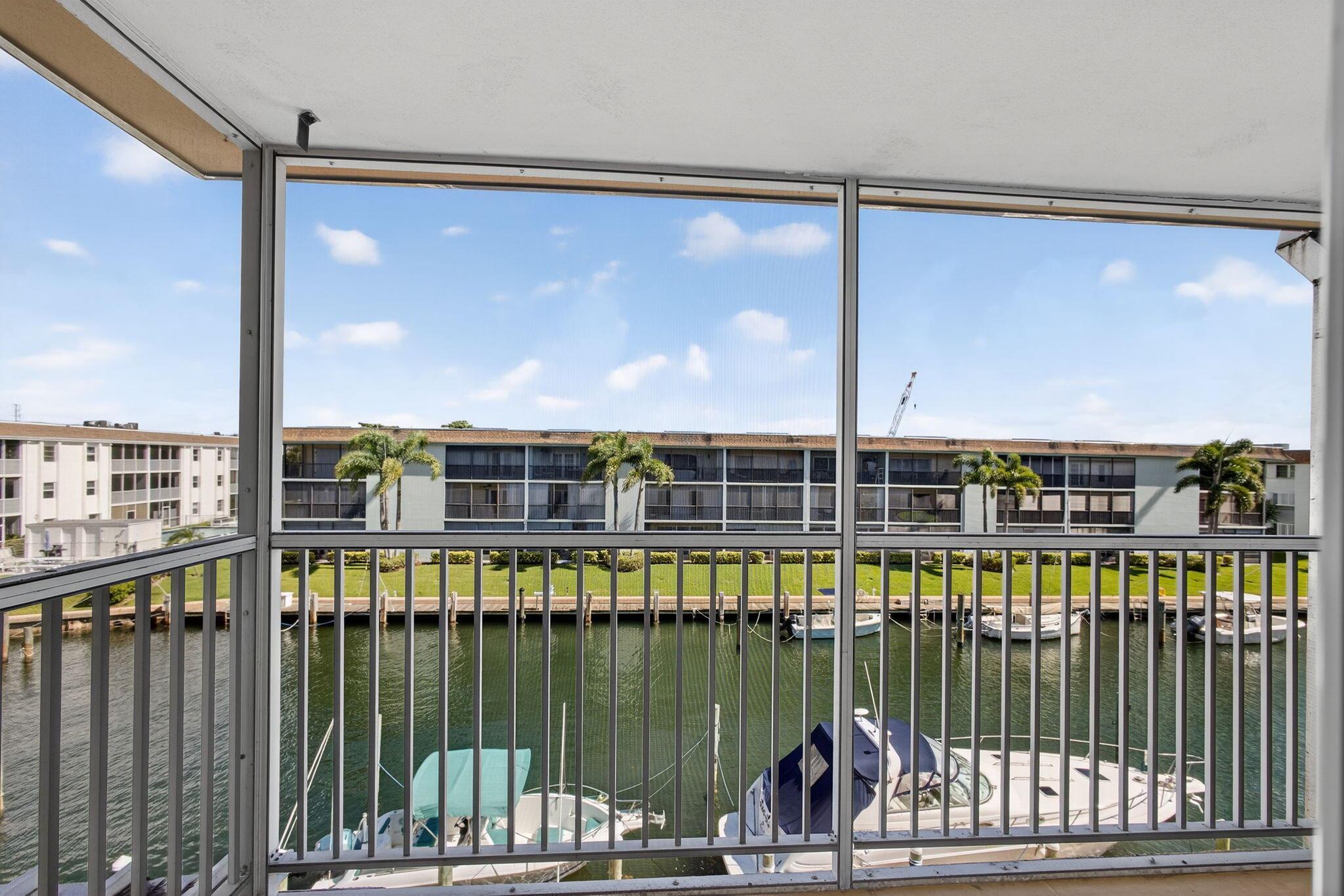 Live on the water! Neat as a pin and a great price! Beautiful one bedroom, one bathroom available on the 3rd floor with newly updated kitchen, featuring granite countertops and white soft close shaker cabinets. Enjoy serene water views from the bedroom and balcony. This unit has been freshly painted and renovated with new neutral carpet throughout, laminate flooring in kitchen, hurricane impact windows, doors and slider, accordion shutters, new appliances and water heater and a brand new a/c, updated electrical and lighting. New roof! Lake Colony is an over 55 community. Boat slips are available to lease inexpensively from the association, first come first serve. Central location near NPB Country Club and I-95, 10 min. to beaches.
