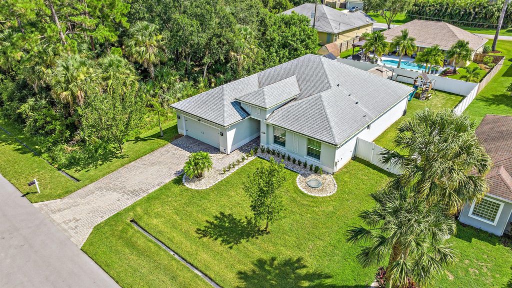 Photo of 1931 SW Mackenzie Street, Port St Lucie, FL 34953 (MLS # R10910852)