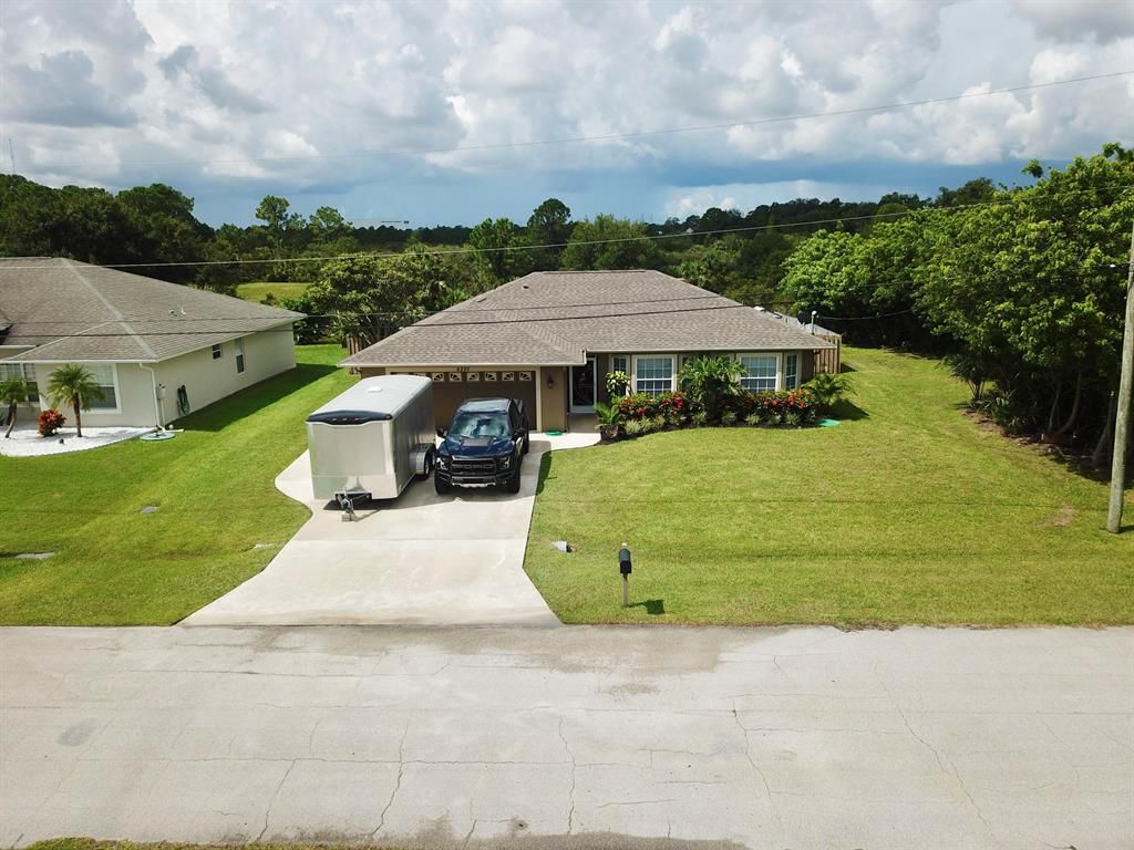 Photo of 6220 NW Hacienda Lane, Port Saint Lucie, FL 34986 (MLS # R10734749)