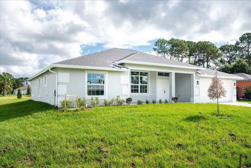 Photo of 1391 SW Tadlock Avenue, Port Saint Lucie, FL 34953 (MLS # R11006215)