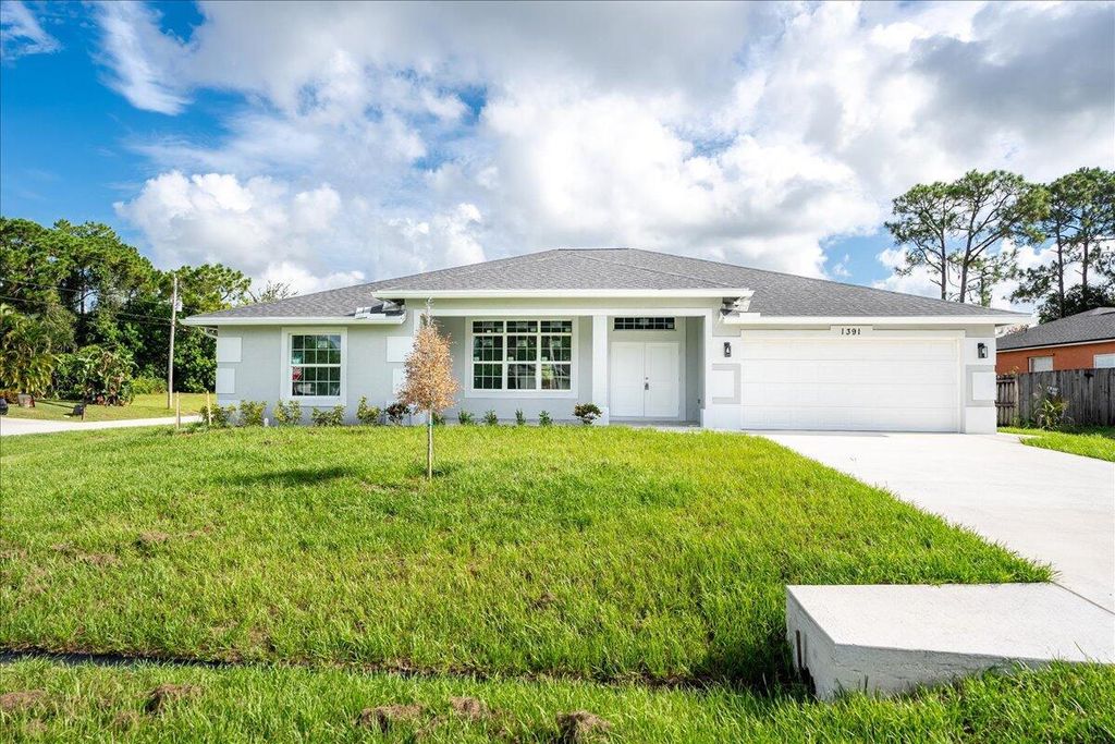 Photo of 1391 SW Tadlock Avenue, Port Saint Lucie, FL 34953 (MLS # R11006215)