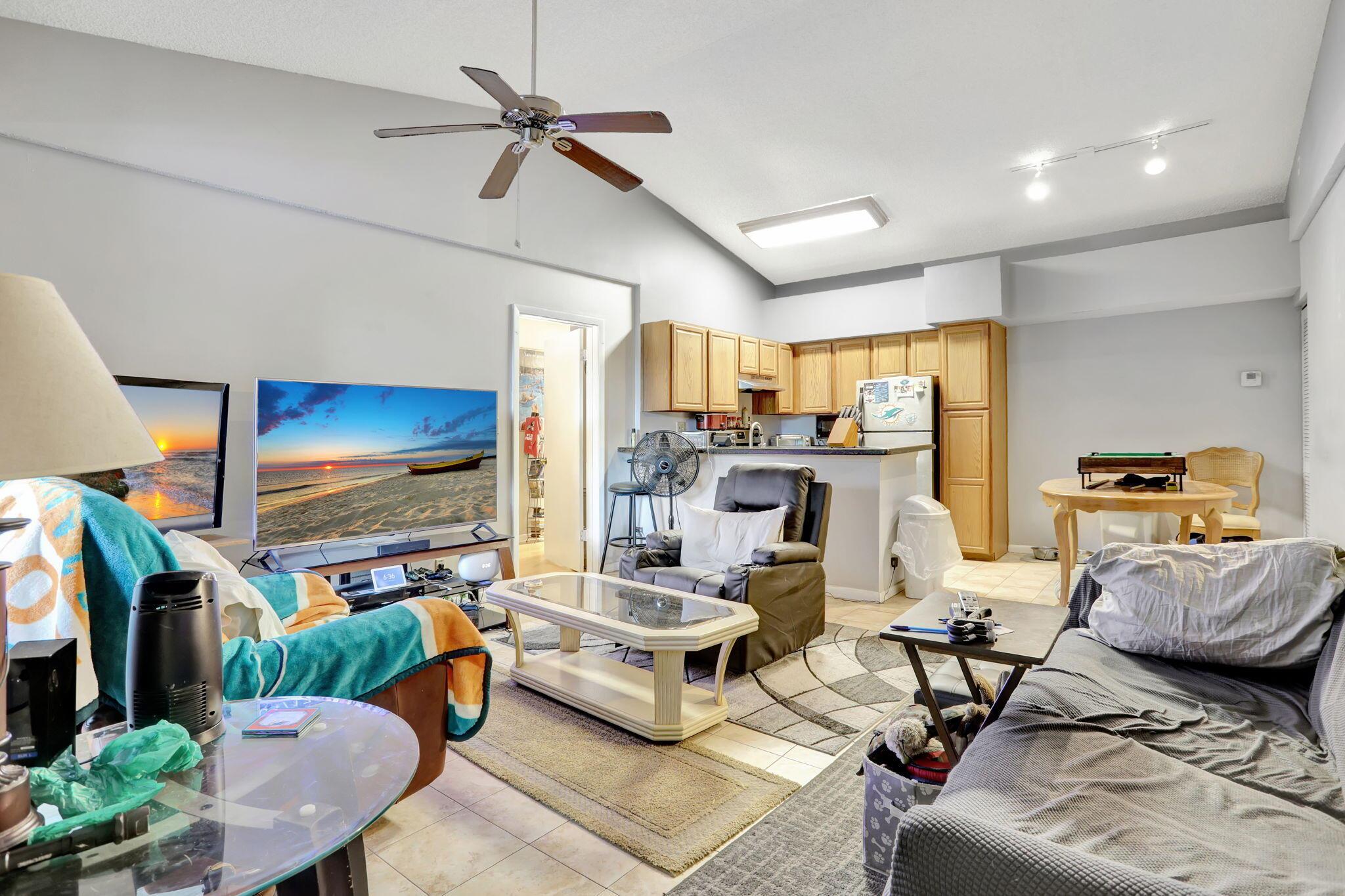 Rare Opportunity in Coco Parc - Lowest Priced 2-Bedroom Corner Unit!Don't miss this exceptional value in the highly desirable Coco Parc community! This spacious 2-bedroom, 2-bathroom corner condo offers a rare combination of flexibility, location, and lifestyle. Whether you're an end-user, investor, or seasonal resident, this property fits your needs.Currently rented month-to-month at $2,200 to reliable long-term tenants eager to extend, this unit is investment-ready. Prefer to move in or use it seasonally? Enjoy the benefit of flexible occupancy without long-term carry costs.Step inside to soaring vaulted ceilings and a light-filled open floor plan. The kitchen features granite countertops, wood cabinetry, stainless steel appliances, and seamlessly flows into the dining