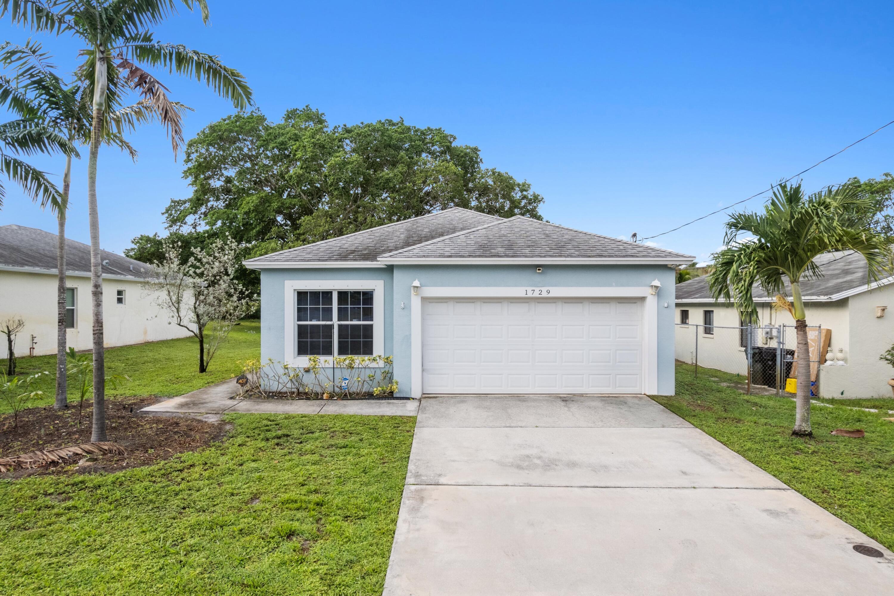 ABSOLUTELY GORGEOUS SINGLE-FAMILY HOME | PRIME LAKE WORTH LOCATION | MINUTES TO BEACH | HUGE OVERSIZED LOT | Bright Open Split Floor Plan | Dramatic Volume Ceilings | LED Recessed Lighting | Freshly Painted Interior | Eat-In Kitchen | Large Breakfast Bar & Serving Window | White Wood Cabinets | Granite Counters | Pantry | Primary Bedroom | En-suite | Walk-In Closet | Large Backyard |Tropical Lush Manicured Landscaping | Mango Tree | 2 Car GA with Storage | Large Driveway | Minutes to Beach, Delray Beach Atlantic Ave, Fine Dining & Shops | Top A+ Rated Schools | New WH 2025 | AC 2014 | PRESENT ALL OFFERS!