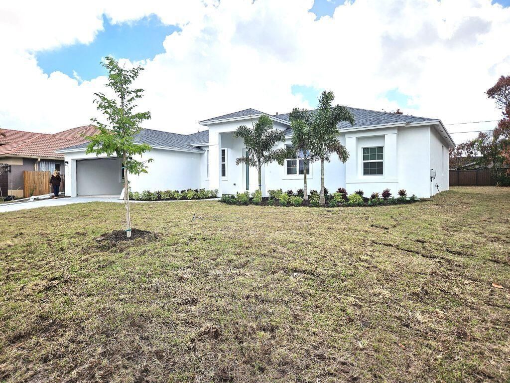 Photo of 758 SW Mccoy Avenue, Port Saint Lucie, FL 34953 (MLS # R11168869)