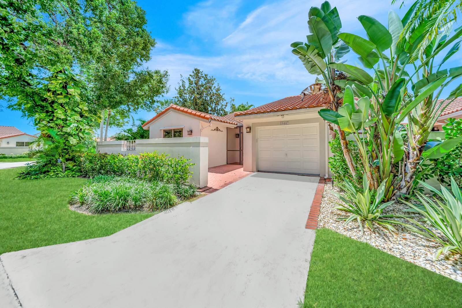 Renovated Waterfront Corner Villa in Brentwood of Boca on a Corner Lot featuring a spacious split floor plan with 3 bedrooms, 2 baths, & 1 car garage! Dramatic entrance w/soaring volume ceilings & picturesque amazing views of the lake. Enjoy the sense of openness, volume & space! Gourmet kitchen is redone featuring Quartz counter-tops, unique decorator backsplash that blends w/the upgraded Stainless appliances, tons of modern grey cabinetry, deep stainless sink, & so much more. Eat in kitchen has a sunny patio area off the kitchen that makes for an additional eating area. Master suite features huge walk in closet & gorgeous brand-new bathroom retreat!! Both bathrooms are super fabulous and the renovation was just completed. Sliders leading to the enormous screened in tropical oasis