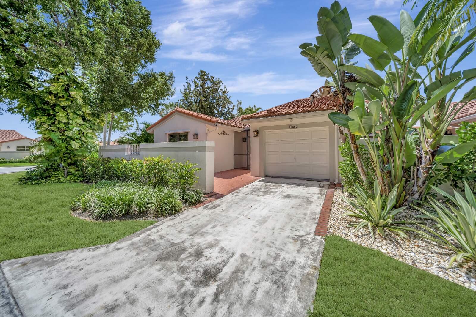 Renovated Waterfront Corner Villa in Brentwood of Boca on a Corner Lot featuring a spacious split floor plan with 3 bedrooms, 2 baths, & 1 car garage! Dramatic entrance w/soaring volume ceilings & picturesque amazing views of the lake. Enjoy the sense of openness, volume & space! Gourmet kitchen is redone featuring Quartz counter-tops, unique decorator backsplash that blends w/the upgraded Stainless appliances, tons of modern grey cabinetry, deep stainless sink, & so much more. Eat in kitchen has a sunny patio area off the kitchen that makes for an additional eating area. Master suite features huge walk in closet & gorgeous brand-new bathroom retreat!! Both bathrooms are super fabulous and the renovation was just completed. Sliders leading to the enormous screened in tropical oasis