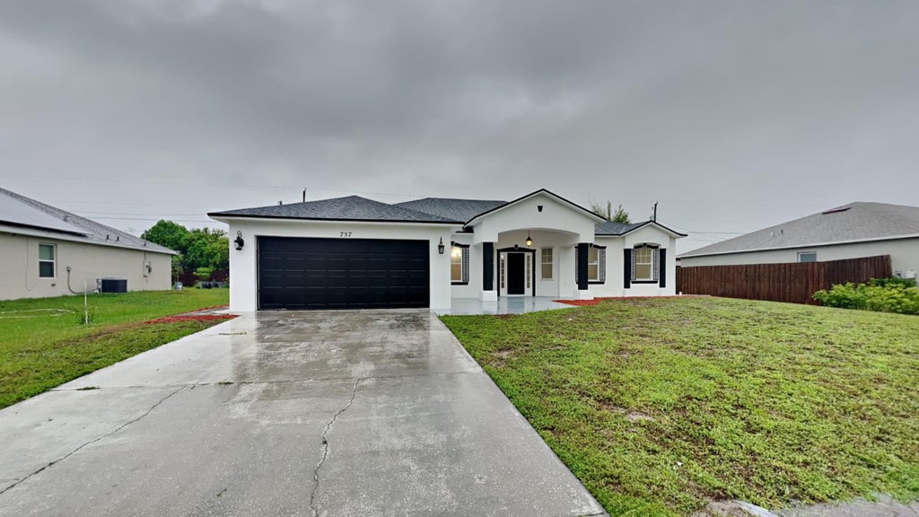 Photo of 757 SW Jacoby Avenue, Port Saint Lucie, FL 34953 (MLS # R10998146)
