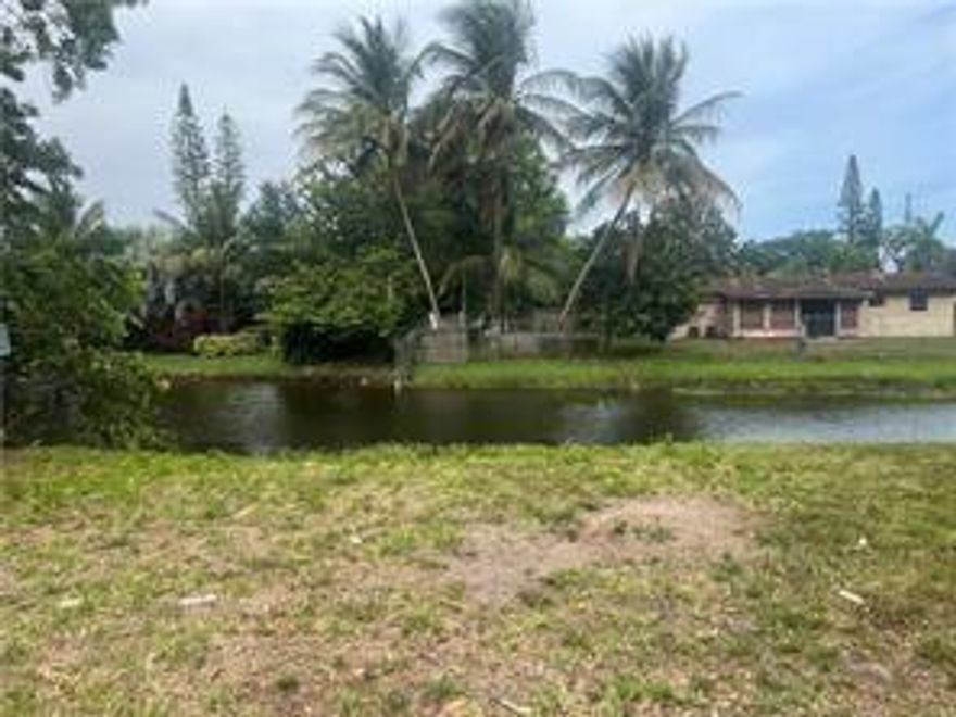 Perfect opportunity to build your dream home in a peaceful residential neighborhood! This property, free from HOA restrictions, is located on a tranquil dead-end street. The front of the lot features a green space that cannot be developed, ensuring lasting natural beauty. The rear of the property backs onto a spacious canal, perfect for a dock and relaxation. The side, the largest part of the lot, is bordered by an existing 6-foot block wall for added privacy.

Please note, Google Maps incorrectly shows the property on the south side of 6th Street; it is actually located on the north side. Permits and fees have already been paid, simplifying the building process for you. Don’t miss this chance to create your ideal home in a wonderful location!