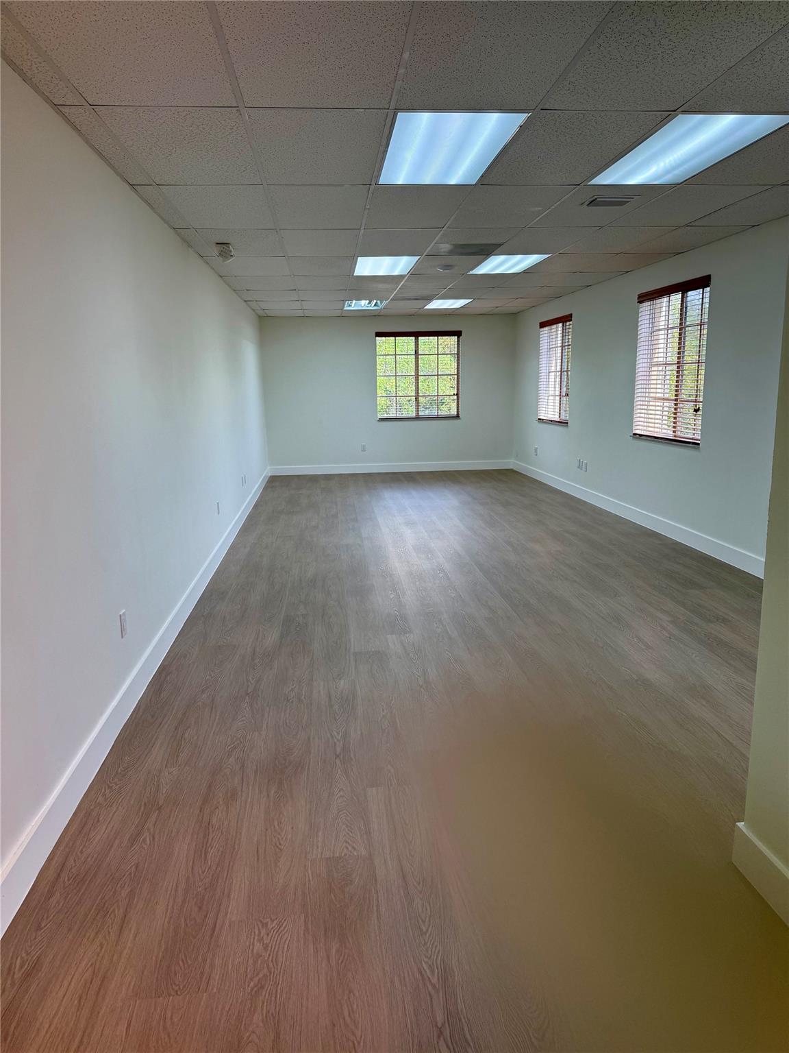 Amazing opportunity to RENT an office space in a great building along high traffic street. Unit includes very functional space located on the corner second floor with private office overlooking Stirling Road. Freshly painted and clean, new floors and open floor plan in main area with semi-private space. Building has common area with elevator access and lobby as well as covered and uncovered parking. Property is very well maintained and secure. Located near large shopping complexes and 2 miles from Florida Turnpike.