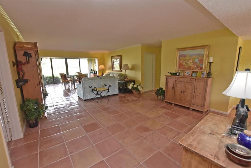 Stunning lake and golf views. Visualize yourself in this very special 3 bedroom 2 bath 1st floor residence with lovely lake & golf views. Open kitchen with light wood cabinetry, white counter tops and mosaic tiled back splash. Stainless appliances.Breakfast nook with sliders to access open patio. Spacious living and dining areas, providing many conversational areas to relax and enjoy your fantastic view from. Large master bedroom and updated bath. Master bath features a dual sink vanity in white with light green counter top and gorgeous blue/green mosaic tile wall. Step-in shower with glass enclosure.Guest bath has also been updated with white vanity, multi-color counter top and blue glass tile backsplash. 3rd bedroom  used as a den but easily converted to bedroom. Must see to appreciate! Mandatory membership.  Quail Ridge is a private, member-owned community and club. All residents are members of Quail Ridge Country Club and have a choice of either a golf or a social/tennis membership.