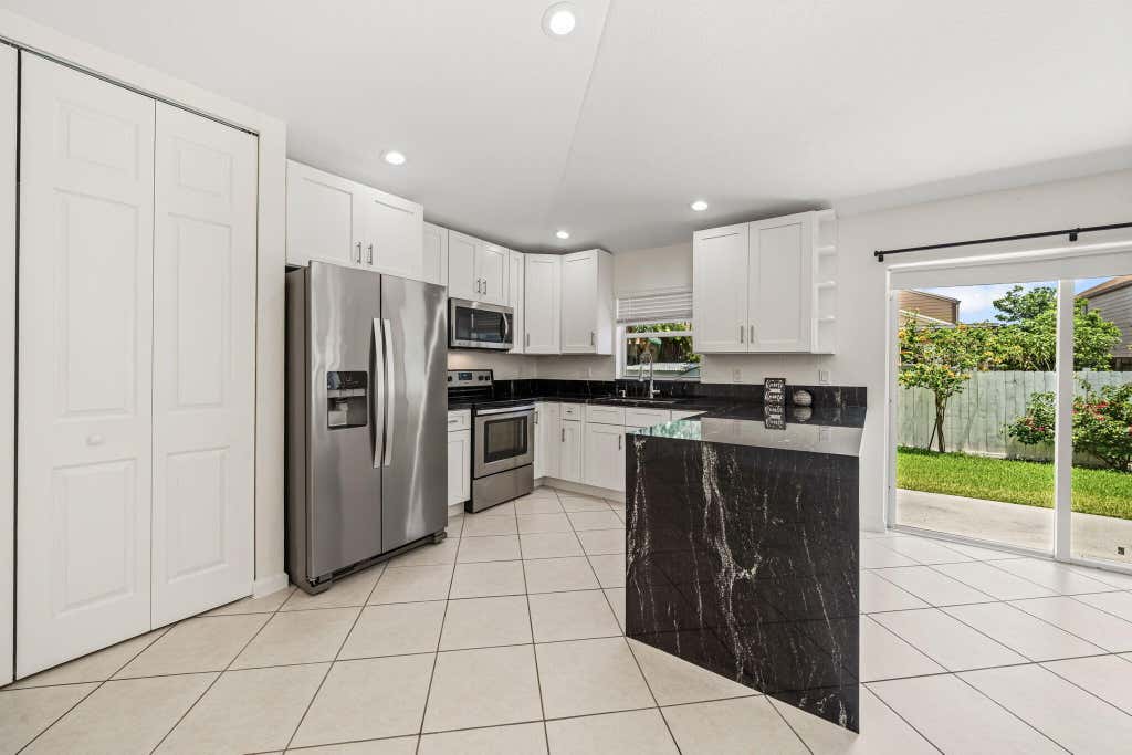 Photo of 6196 Azalea Circle, West Palm Beach, FL 33415 (MLS # B26041566)